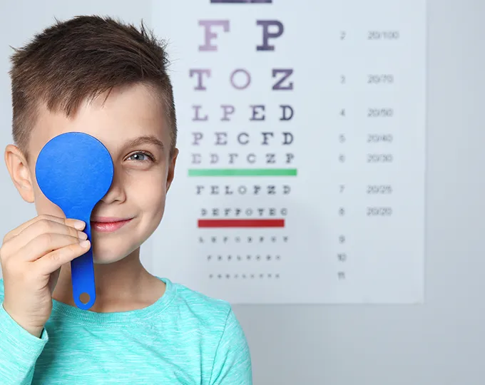 young boy having a vision exam in Lebanon Illinois or breese illinois